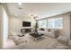 Bright, open-plan living room with a large window, ceiling fan, and tile flooring at 9655 Shadow Cliff Ave, Las Vegas, NV 89166