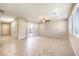 Spacious living room with tile floors and large window at 9655 Shadow Cliff Ave, Las Vegas, NV 89166