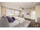 Cozy main bedroom with wood floors, ceiling fan, and natural light from the windows at 9655 Shadow Cliff Ave, Las Vegas, NV 89166