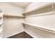 View of walk-in closet with wood floors and shelving units for ample storage at 9655 Shadow Cliff Ave, Las Vegas, NV 89166