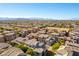Neighborhood aerial showcasing the community layout and surrounding landscape with mountains in the distance at 9986 Sand Key St, Las Vegas, NV 89178