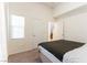 Bedroom with plush carpeting and a window for natural light at 9986 Sand Key St, Las Vegas, NV 89178