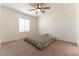 Bedroom with ceiling fan and window for natural light at 9986 Sand Key St, Las Vegas, NV 89178