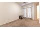 Bright bedroom featuring plush carpeting and a door leading to the outdoor space at 9986 Sand Key St, Las Vegas, NV 89178