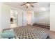Bedroom featuring a ceiling fan and multiple doors and passageways at 9986 Sand Key St, Las Vegas, NV 89178