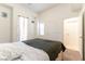 Bedroom with multiple doors and windows for natural light at 9986 Sand Key St, Las Vegas, NV 89178