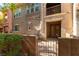 Attractive townhouse with a well-maintained front yard and charming architectural details at 9986 Sand Key St, Las Vegas, NV 89178