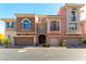 Beautiful multi-level townhome featuring a two-car garage and neutral exterior at 9986 Sand Key St, Las Vegas, NV 89178