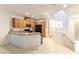 Charming kitchen with light wood cabinets and granite countertops. Complete with modern black appliances at 9986 Sand Key St, Las Vegas, NV 89178