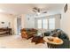 Open living space with tile flooring, ceiling fan, and sliding glass doors to the outside at 9986 Sand Key St, Las Vegas, NV 89178