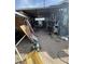 Outdoor storage area featuring metal shelving, tools, and various household items at , Las Vegas, NV 89104