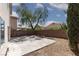 Large backyard with patio and block wall at 10075 Yellow Canary Ave, Las Vegas, NV 89117