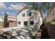 Backyard view featuring a concrete patio, gravel ground cover and surrounding block wall at 10075 Yellow Canary Ave, Las Vegas, NV 89117