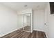 Bedroom featuring hardwood floors, closet with sliding doors, and fresh neutral paint at 10075 Yellow Canary Ave, Las Vegas, NV 89117