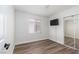 Bright bedroom with hardwood floors, closet, and window at 10075 Yellow Canary Ave, Las Vegas, NV 89117