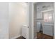 Laundry room with sink, window, and modern washer and dryer at 10075 Yellow Canary Ave, Las Vegas, NV 89117