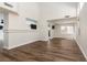 Open-concept living room features wood flooring, large windows, and ample space for entertaining at 10075 Yellow Canary Ave, Las Vegas, NV 89117