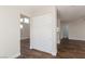 Bright open-concept living area with hardwood floors and a built-in storage closet at 10075 Yellow Canary Ave, Las Vegas, NV 89117