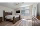 Comfortable main bedroom featuring vaulted ceilings, a ceiling fan, and plenty of natural light at 10075 Yellow Canary Ave, Las Vegas, NV 89117