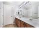 Bathroom with a long vanity and large mirror at 10259 Wolves Den Ln, Las Vegas, NV 89178