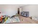 Bedroom with a crib and lots of toys at 10259 Wolves Den Ln, Las Vegas, NV 89178
