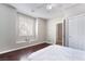 Inviting bedroom with hardwood floors, a window seat and light, neutral walls at 10259 Wolves Den Ln, Las Vegas, NV 89178