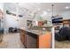 Kitchen with stainless steel appliances, granite countertops, breakfast bar and open floorplan at 10259 Wolves Den Ln, Las Vegas, NV 89178