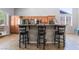 Kitchen with island with seating and stainless steel appliances at 10259 Wolves Den Ln, Las Vegas, NV 89178