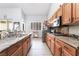 Kitchen with stainless steel appliances, granite countertops and tile floors at 10259 Wolves Den Ln, Las Vegas, NV 89178