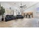 Open-concept floorplan, high ceilings, tiled floors, connecting the living room and kitchen at 10259 Wolves Den Ln, Las Vegas, NV 89178