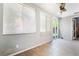 Bright sun room with tile flooring and sliding glass door to the backyard at 10259 Wolves Den Ln, Las Vegas, NV 89178