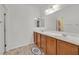 Bathroom featuring double sinks and wooden cabinetry at 1121 Via Castelli, Henderson, NV 89052