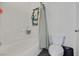 Bright bathroom features a shower-tub combination with a white tile surround and a toilet at 1121 Via Castelli, Henderson, NV 89052