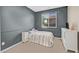 Cozy bedroom with a small bed and carpet flooring at 1121 Via Castelli, Henderson, NV 89052