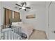 Bedroom with ceiling fan and large bed at 1121 Via Castelli, Henderson, NV 89052