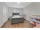 Cozy bedroom with a tufted headboard and neutral decor at 1121 Via Castelli, Henderson, NV 89052