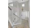 Bright entryway featuring high ceilings, tile flooring, and a staircase with white railings at 1121 Via Castelli, Henderson, NV 89052