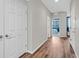 Hallway features hardwood floors and white doors at 1121 Via Castelli, Henderson, NV 89052