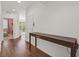 Hallway featuring laminate floors, neutral walls, and access to other rooms at 1121 Via Castelli, Henderson, NV 89052