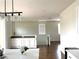 Open-concept living area with modern lighting and staircase at 1121 Via Castelli, Henderson, NV 89052