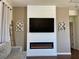 Inviting living room with a modern fireplace and TV at 1121 Via Castelli, Henderson, NV 89052