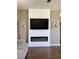 Comfortable living room featuring a modern fireplace with a sleek electric insert and accent wall at 1121 Via Castelli, Henderson, NV 89052