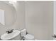 Small powder room with a pedestal sink and toilet at 1121 Via Castelli, Henderson, NV 89052