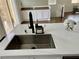 Close up of kitchen island sink with faucet and marble countertop at 1121 Via Castelli, Henderson, NV 89052