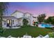 Beautiful backyard with lush artificial turf, patio furniture, and a sparkling pool at 1200 Dry Point Ct, Las Vegas, NV 89144
