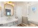 Clean bathroom featuring a vanity with marble countertops, gold fixtures, and a combination tub and shower at 1200 Dry Point Ct, Las Vegas, NV 89144