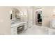 Bathroom vanity with a make up area featuring natural light, a stool, and under cabinet drawers at 1200 Dry Point Ct, Las Vegas, NV 89144