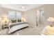 Bright bedroom showcasing abundant natural light and a comfortable bed with views of the landscape at 1200 Dry Point Ct, Las Vegas, NV 89144