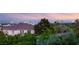 Picturesque skyline and treetop views from this home overlooking the Las Vegas cityscape at sunset at 1200 Dry Point Ct, Las Vegas, NV 89144