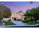 Stunning two-story home with a well-manicured lawn, lush landscaping, and a private driveway at 1200 Dry Point Ct, Las Vegas, NV 89144